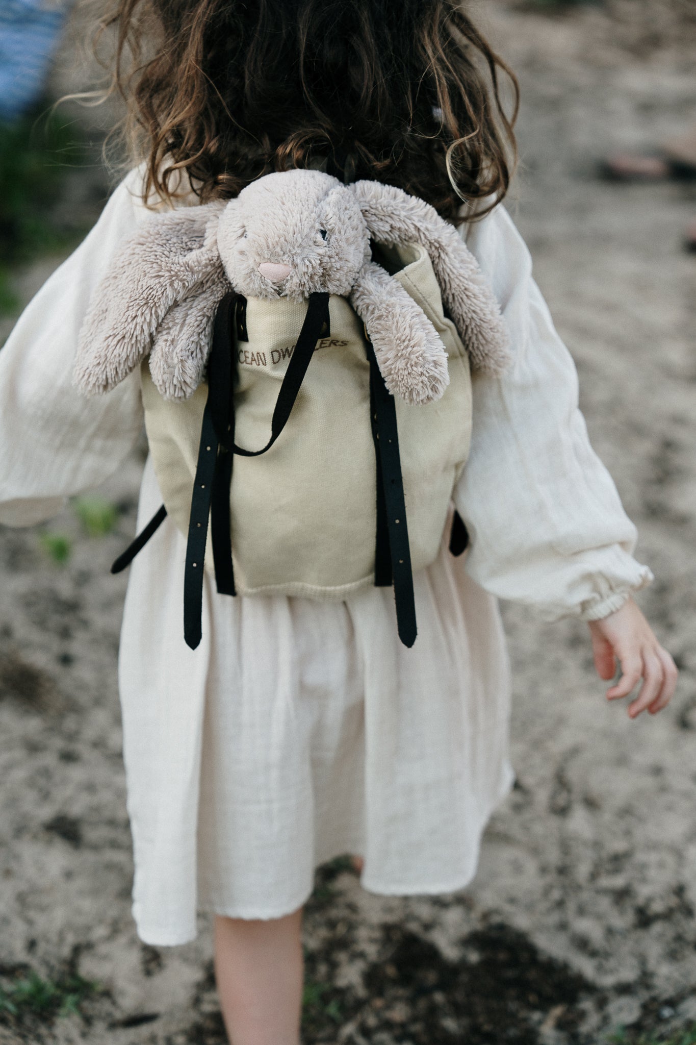 Toy rabbit in children's backpack